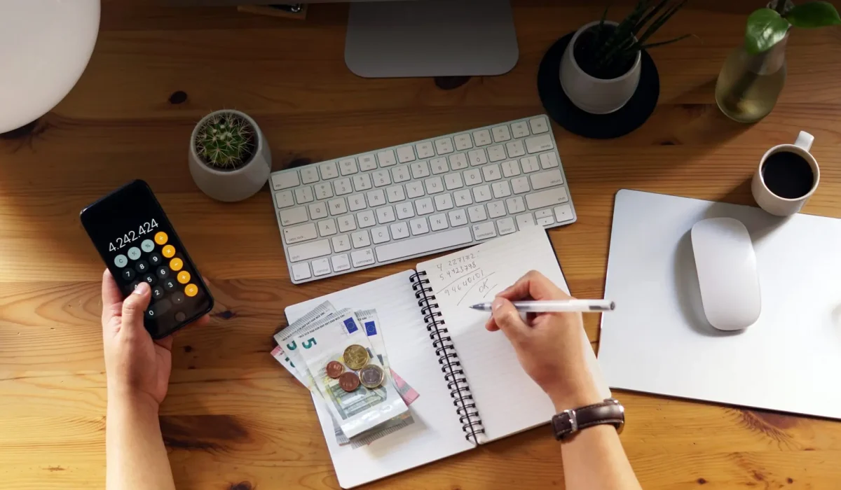 A closeup shot of an entrepreneur working from home on his personal finances and savings